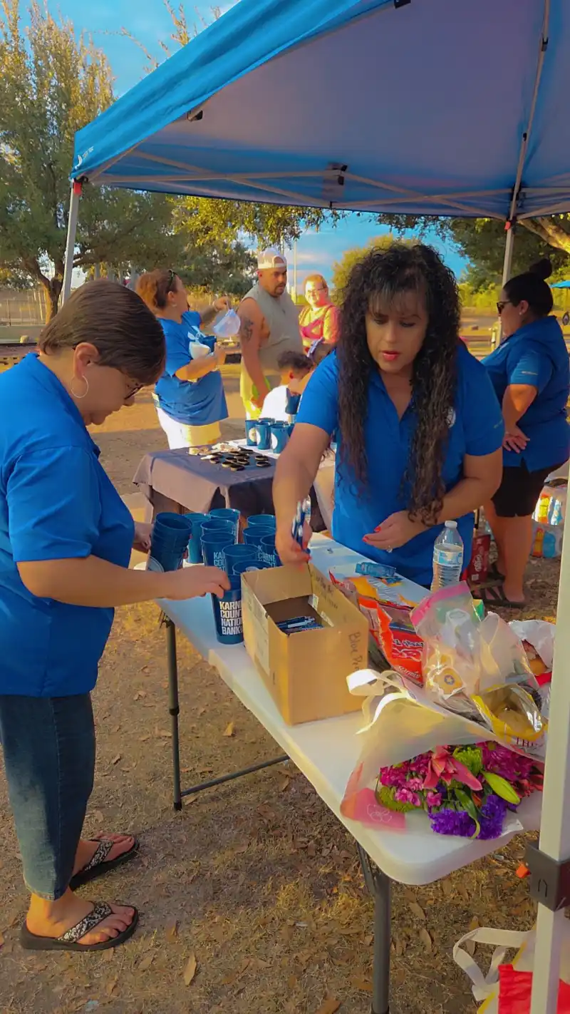 Bernice & Corina sorting out KCNB merch at National Night Out.